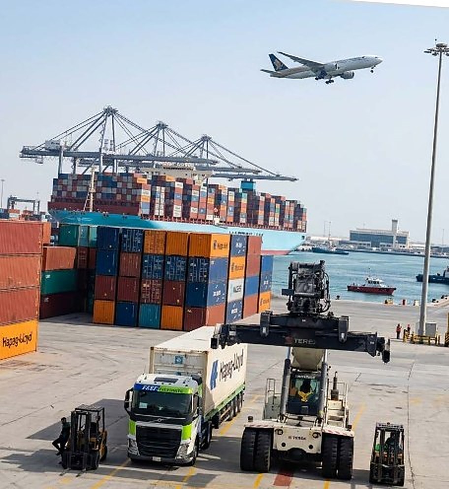 Container terminal with aircraft overhead, reach stacker and Fast n Accurate truck loading