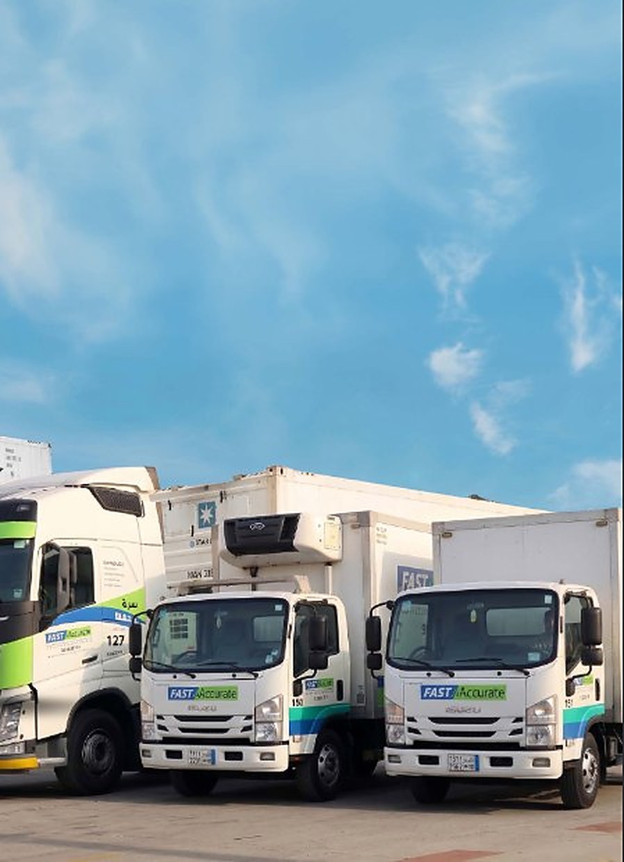 Fast n Accurate reefer and dry box trucks lined up in the yard